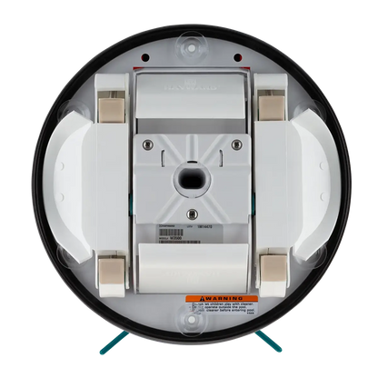 Bottom view of the My Store Hayward Aqua Bug pool cleaner showing wheels, brush housing, sensors, and warning label. Its design is mostly white with black and beige accents.